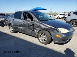 2007 Ford Focus S z VIN 1FAHP34N77W192231, wystawiony jako Copart lot #59020505 z przebiegiem 99 284 mil mil oraz Szkoda całkowita • Salvage title. Historia ofert i sprzedaży dostępna na DreamBid. Obrazek 4.