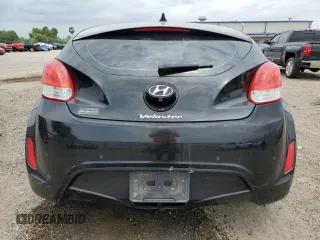 2014 Hyundai Veloster z VIN KMHTC6AD0EU188863, wystawiony jako Copart lot #54750925 z przebiegiem 96 212 mil mil oraz Szkoda całkowita • Salvage title. Historia ofert i sprzedaży dostępna na DreamBid. Obrazek 6.