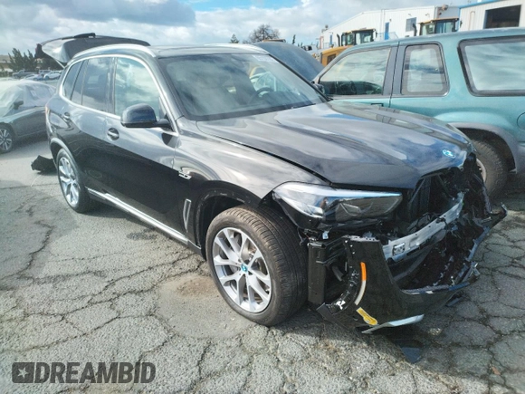 2022 BMW X5 xDrive45e with VIN 5UXTA6C01N9M84108, listed as a Copart auction lot 65150782 with 5,977 mi miles. Bid and sale history available at carsss.com. Image 1.