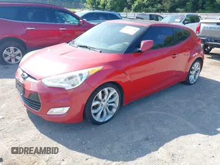 2012 Hyundai Veloster w/Black Int with VIN KMHTC6AD3CU032989, listed as a IAAI auction lot 42633748 with 137,727 mi miles and . Bid and sale history available at DreamBid. Image 2.