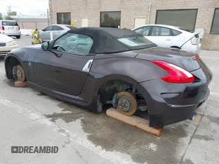 2010 Nissan 370Z Touring with VIN JN1AZ4FH3AM301311, listed as a IAAI auction lot 41976379 with 51,347 mi miles. Bid and sale history available at carsss.com. Image 3.
