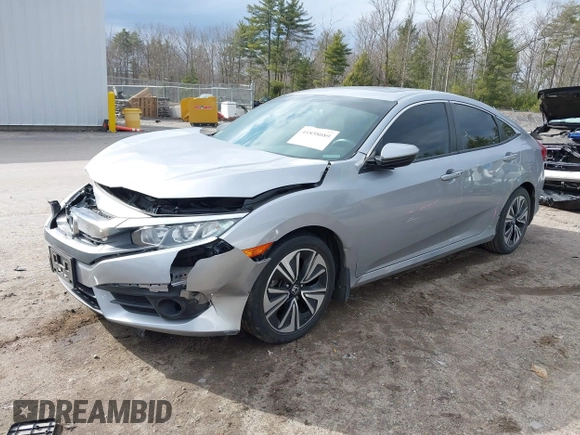 2018 Honda Civic EX-T z VIN 2HGFC1F34JH641837, wystawiony jako IAAI lot #41858089 z przebiegiem 65 318 mil mil oraz . Historia ofert i sprzedaży dostępna na DreamBid. Obrazek 17.