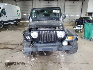 2002 Jeep Wrangler Sport with VIN 1J4FA49S62P713475, listed as a Copart auction lot 59299965 with 114,654 mi miles and Non repairable. Bid and sale history available at DreamBid. Image 5.