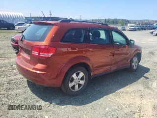2013 Dodge Journey American Value z VIN 3C4PDCAB1DT656317, wystawiony jako Copart lot #58525885 z przebiegiem 210 834 mil mil oraz Szkoda całkowita • Salvage title. Historia ofert i sprzedaży dostępna na DreamBid. Obrazek 3.
