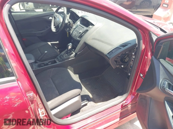 2016 Ford Focus SE z VIN 1FADP3F28GL237888, wystawiony jako IAAI lot #42564140 z przebiegiem 143 210 mil mil oraz . Historia ofert i sprzedaży dostępna na DreamBid. Obrazek 5.