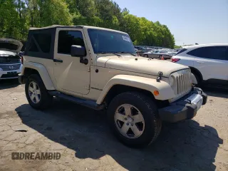 2011 Jeep Wrangler Sahara z VIN 1J4AA5D10BL528862, wystawiony jako Copart lot #53488515 z przebiegiem 198 865 mil mil oraz Szkoda całkowita • Salvage title. Historia ofert i sprzedaży dostępna na DreamBid. Obrazek 4.