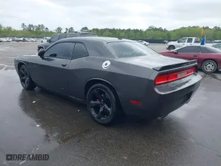 2013 Dodge Challenger SXT with VIN 2C3CDYAG1DH611432, listed as a IAAI auction lot 41954202 with 235,198 mi miles. Bid and sale history available at carsss.com. Image 3.