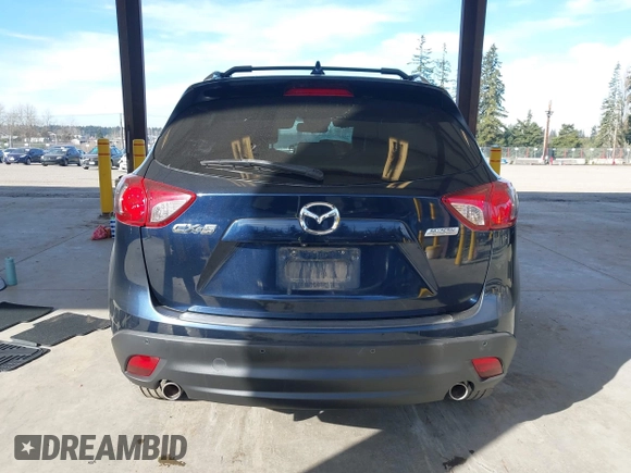 2014 Mazda CX-5 Grand Touring with VIN JM3KE2DY6E0394172, listed as a IAAI auction lot 41698468 with 89,554 mi miles. Bid and sale history available at carsss.com. Image 16.