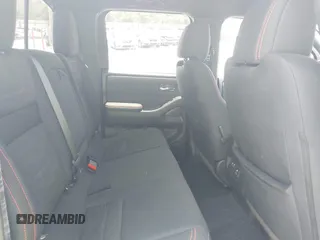 2022 Nissan Frontier Pro-4X z VIN 1N6ED1EK3NN634775, wystawiony jako IAAI lot #42789790 z przebiegiem 25 453 mil mil oraz . Historia ofert i sprzedaży dostępna na DreamBid. Obrazek 8.