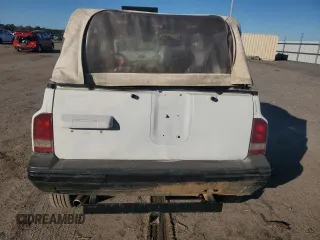 1990 Geo Tracker z VIN 2CNBJ18UXL6217744, wystawiony jako Copart lot #84203244 z przebiegiem 23 221 mil mil oraz Szkody całkowita. Historia ofert i sprzedaży dostępna na DreamBid. Obrazek 6.