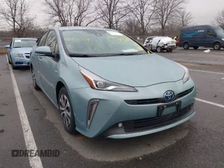 2021 Toyota Prius LE z VIN JTDL9MFU3M3027475, wystawiony jako IAAI lot #41155738 z przebiegiem 30 810 mil mil oraz . Historia ofert i sprzedaży dostępna na DreamBid. Obrazek 1.