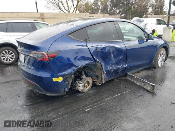 2022 Tesla Model Y Long Range with VIN 7SAYGDEE7NF409294, listed as a IAAI auction lot 41845261 with 73,116 mi miles and . Bid and sale history available at DreamBid. Image 4.