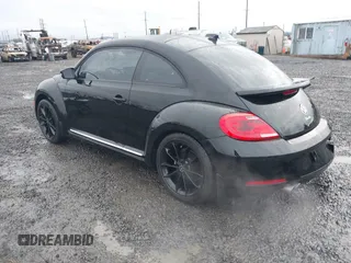2014 Volkswagen Beetle 2.5L w/Sun with VIN 3VWJP7AT3EM608906, listed as a IAAI auction lot 41501830 with 42,804 mi miles and . Bid and sale history available at DreamBid. Image 3.