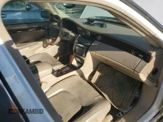 2004 Cadillac DeVille DTS z VIN 1G6KF57964U242365, wystawiony jako Copart lot #41645555 z przebiegiem Nie podano mil oraz Szkody całkowita. Historia ofert i sprzedaży dostępna na DreamBid. Obrazek 8.