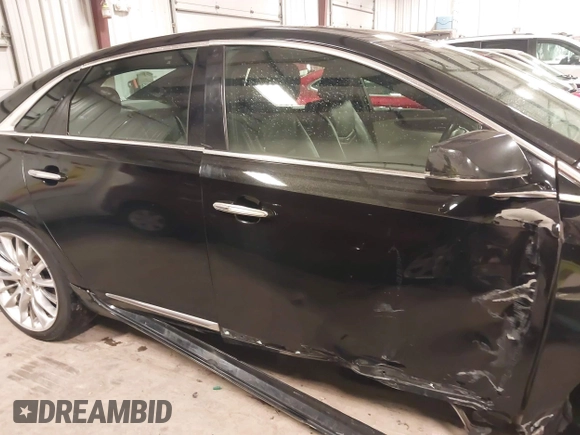 2014 Cadillac XTS Platinum with VIN 2G61W5S88E9186969, listed as a IAAI auction lot 41422872 with 184,998 mi miles and . Bid and sale history available at DreamBid. Image 13.