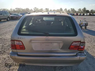 2000 Mercedes-Benz E-Class with VIN WDBJH65J4YB071699, listed as a Copart auction lot 75082144 with 105,989 mi miles and Salvage Title. Bid and sale history available at carsss.com. Image 6.