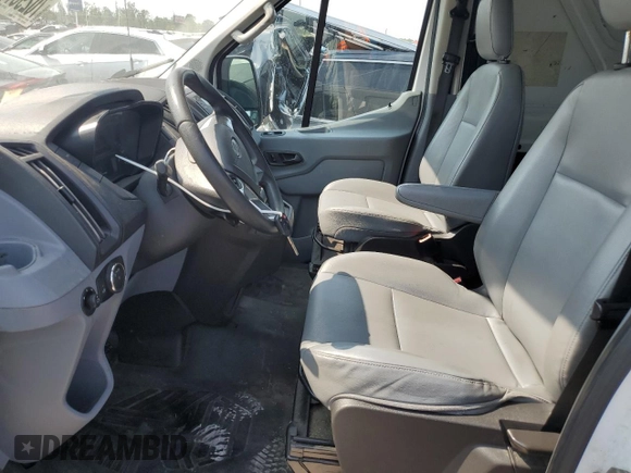 2016 Ford Transit Cargo z VIN 1FTYR2CM3GKB31134, wystawiony jako Copart lot #70293794 z przebiegiem 65 457 mil mil oraz Szkoda całkowita • Salvage title. Historia ofert i sprzedaży dostępna na DreamBid. Obrazek 7.
