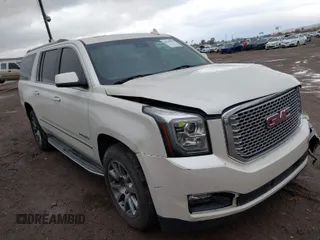 2015 GMC Yukon XL Denali with VIN 1GKS2JKJ2FR590502, listed as a IAAI auction lot 41758575 with 129,777 mi miles. Bid and sale history available at carsss.com. Image 1.