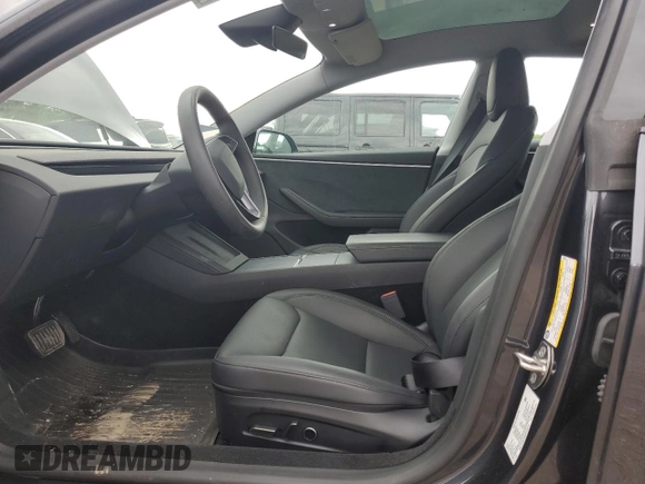 2024 Tesla Model 3 Long Range with VIN 5YJ3E1EB2RF825213, listed as a Copart auction lot 51909875 with 9,717 mi miles and Salvage Title. Bid and sale history available at DreamBid. Image 7.