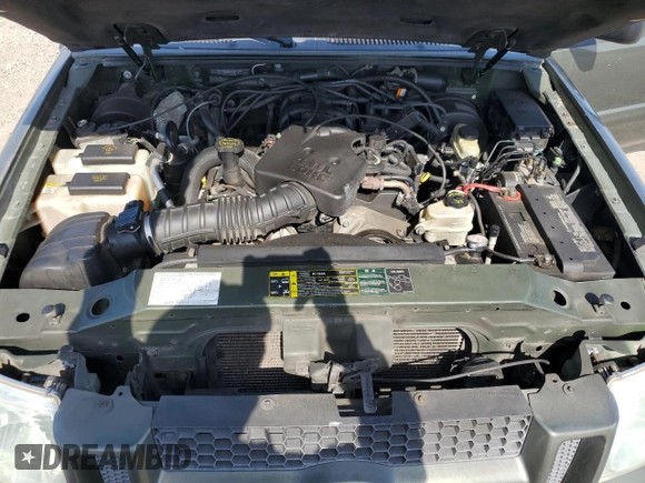 2004 Ford Explorer Sport Trac XLS with VIN 1FMZU67K64UA39174, listed as a Copart auction lot 61035465 with 196,912 mi miles and Salvage title. Bid and sale history available at DreamBid. Image 11.