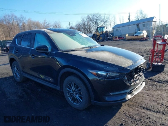 2021 Mazda CX-5 Touring with VIN JM3KFBCM2M1303063, listed as a IAAI auction lot 41814604 with 36,116 mi miles. Bid and sale history available at carsss.com. Image 1.