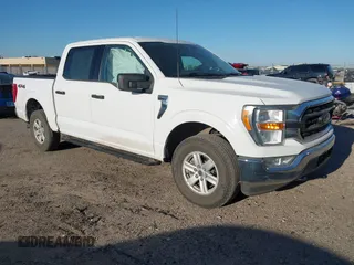 2021 Ford F-150 XL with VIN 1FTEW1EP5MKE25613, listed as a IAAI auction lot 42028237 with 116,341 mi miles. Bid and sale history available at carsss.com. Image 1.