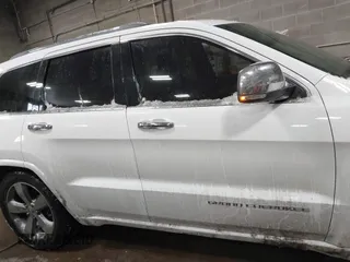 2015 Jeep Grand Cherokee Overland with VIN 1C4RJFCG2FC741015, listed as a IAAI auction lot 41607606 with 132,038 mi miles and . Bid and sale history available at DreamBid. Image 13.