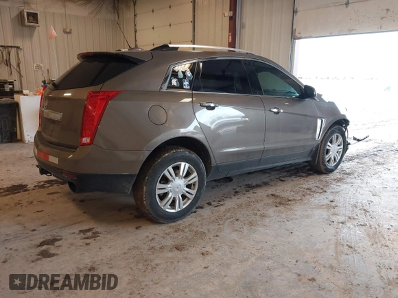 2015 Cadillac SRX Luxury Collection with VIN 3GYFNBE34FS575613, listed as a IAAI auction lot 41697251 with 173,117 mi miles and . Bid and sale history available at DreamBid. Image 4.
