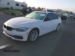 2018 BMW 3 Series 320i with VIN WBA8E1G54JNU90990, listed as a IAAI auction lot 41801197 with 140,603 mi miles. Bid and sale history available at carsss.com. Image 2.