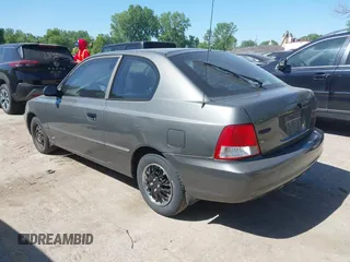 2001 Hyundai Accent GLS z VIN KMHCG35C01U136132, wystawiony jako IAAI lot #42293830 z przebiegiem 111 906 mil mil oraz . Historia ofert i sprzedaży dostępna na DreamBid. Obrazek 3.