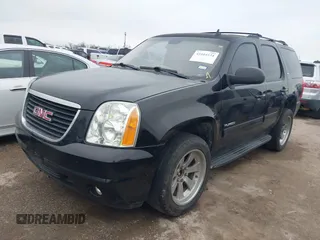 2014 GMC Yukon SLT with VIN 1GKS1CE02ER207447, listed as a IAAI auction lot 41604134 with 199,417 mi miles. Bid and sale history available at carsss.com. Image 2.