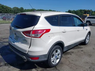 2013 Ford Escape SE with VIN 1FMCU0GX2DUB85361, listed as a IAAI auction lot 42552881 with 211,032 mi miles and . Bid and sale history available at DreamBid. Image 4.
