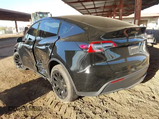 2023 Tesla Model Y Long Range with VIN 7SAYGDEE8PF815622, listed as a IAAI auction lot 41515433 with 70,862 mi miles and . Bid and sale history available at DreamBid. Image 3.