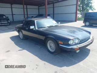 1990 Jaguar XJS z VIN SAJNW4849LC173250, wystawiony jako IAAI lot #42296451 z przebiegiem 88 227 mil mil oraz . Historia ofert i sprzedaży dostępna na DreamBid. Obrazek 1.