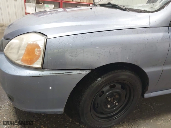 2003 Kia Rio with VIN KNADC125536274171, listed as a IAAI auction lot 41986369 with 59,837 mi miles. Bid and sale history available at carsss.com. Image 6.