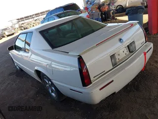 2002 Cadillac Eldorado z VIN 1G6EC12922B106670, wystawiony jako IAAI lot #41648782 z przebiegiem 174 320 mil mil oraz . Historia ofert i sprzedaży dostępna na DreamBid. Obrazek 3.