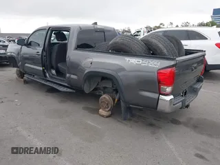 2017 Toyota Tacoma SR5 with VIN 3TMDZ5BN1HM021526, listed as a IAAI auction lot 42204091 with 82,802 mi miles and . Bid and sale history available at DreamBid. Image 3.