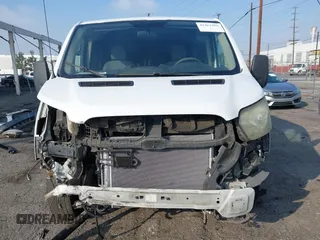 2015 Ford Transit Cargo with VIN 1FTYR1ZM7FKB05121, listed as a IAAI auction lot 41461900 with 190,821 mi miles and . Bid and sale history available at DreamBid. Image 6.