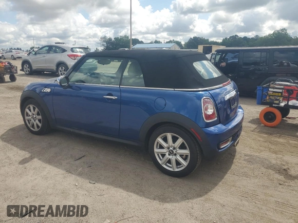 2015 MINI Convertible S with VIN WMWZP3C59F2A91231, listed as a Copart auction lot 59296415 with 31,642 mi miles and Salvage title. Bid and sale history available at DreamBid. Image 2.