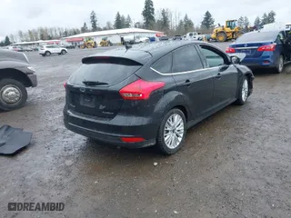 2015 Ford Focus Titanium with VIN 1FADP3N2XFL300859, listed as a IAAI auction lot 41944410 with 76,194 mi miles. Bid and sale history available at carsss.com. Image 4.