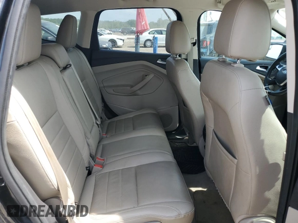 2013 Ford Escape SEL z VIN 1FMCU9HXXDUD65870, wystawiony jako Copart lot #60985855 z przebiegiem 139 440 mil mil oraz Szkoda całkowita • Salvage title. Historia ofert i sprzedaży dostępna na DreamBid. Obrazek 11.