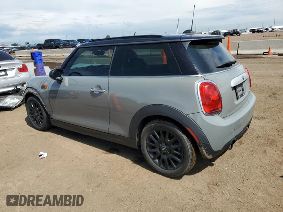 2015 MINI Hardtop with VIN WMWXM5C5XFT974077, listed as a Copart auction lot 58063965 with 93,853 mi miles and Salvage title. Bid and sale history available at DreamBid. Image 2.