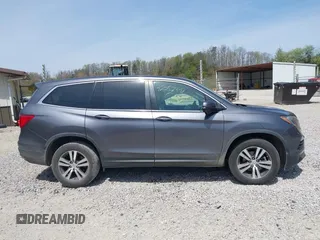 2018 Honda Pilot EX-L with VIN 5FNYF6H52JB066721, listed as a IAAI auction lot 42052842 with 134,393 mi miles and . Bid and sale history available at DreamBid. Image 13.