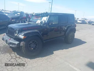 2022 Jeep Wrangler Unlimited Rubicon with VIN 1C4HJXFN0NW242903, listed as a IAAI auction lot 41448636 with 28,007 mi miles and . Bid and sale history available at DreamBid. Image 2.