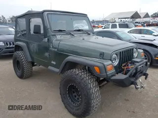 1997 Jeep Wrangler SE z VIN 1J4FY29P4VP403602, wystawiony jako IAAI lot #42428462 z przebiegiem 136 336 mil mil oraz . Historia ofert i sprzedaży dostępna na DreamBid. Obrazek 1.