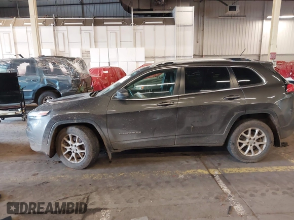 2014 Jeep Cherokee Latitude with VIN 1C4PJMCS4EW272815, listed as a IAAI auction lot 41616504 with 97,613 mi miles and . Bid and sale history available at carsss.com. Image 14.