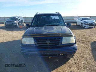 2003 Suzuki Vitara z VIN 2S3TE52V436101091, wystawiony jako IAAI lot #41472279 z przebiegiem 163 429 mil mil oraz . Historia ofert i sprzedaży dostępna na DreamBid. Obrazek 12.