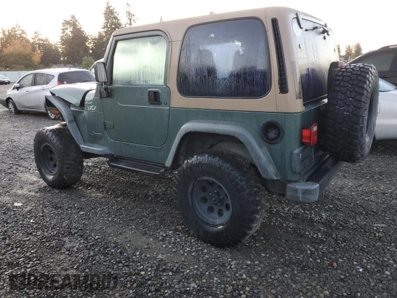2000 Jeep Wrangler Sport with VIN 1J4FA49S1YP748529, listed as a Copart auction lot 77041924 with 154,949 mi miles and Salvage Title. Bid and sale history available at carsss.com. Image 2.