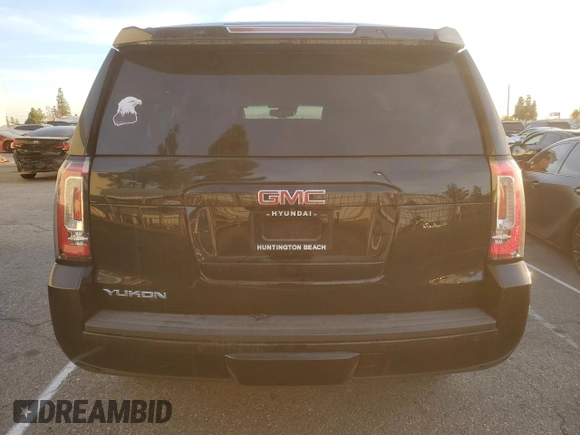 2015 GMC Yukon SLT with VIN 1GKS1BKC9FR144289, listed as a Copart auction lot 42179675 with 122,807 mi miles and Salvage Title. Bid and sale history available at carsss.com. Image 6.