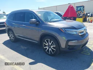 2020 Honda Pilot Touring 8-Passenger with VIN 5FNYF5H90LB000801, listed as a IAAI auction lot 41865605 with 62,743 mi miles and . Bid and sale history available at DreamBid. Image 1.